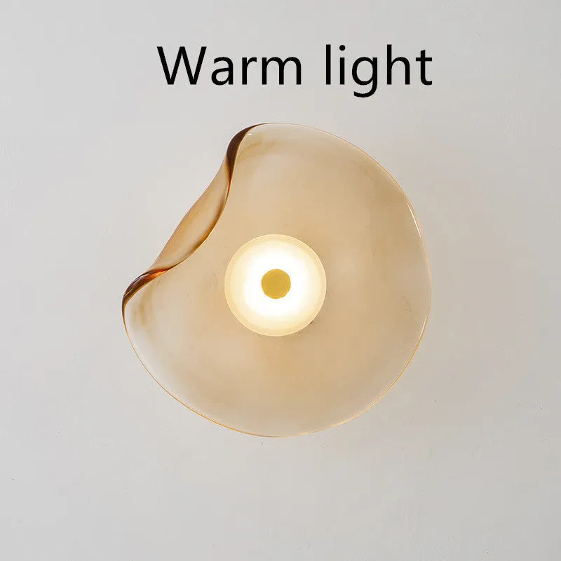 Round glass wall lamp in cognac colour with diffused lighting for bedroom bedside decoration