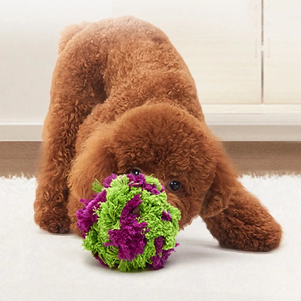 Purple plush dog chew ball with knotted seaweed design measuring 15cm diameter
