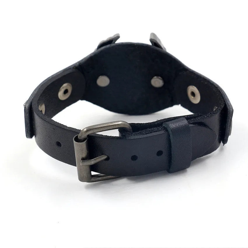 Black geometric leather bracelet with a large alloy eagle watch clasp closure.