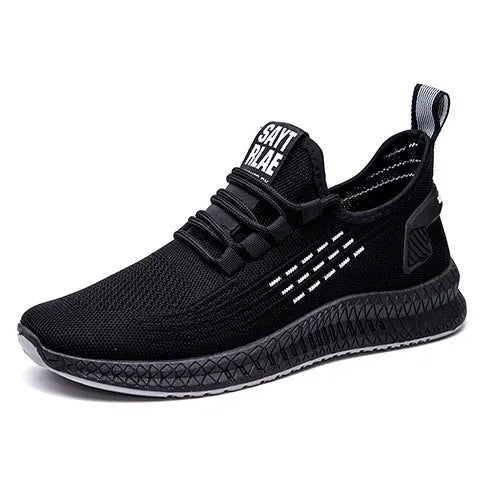 Men's black casual sports shoes with cross-strap detail and Flying Weave textured upper.