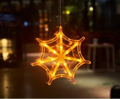 Set of seven Halloween-themed LED hanging lights with suction cups for window display