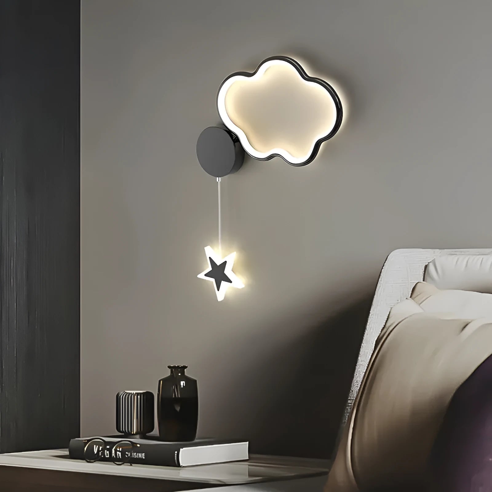 Children's bedside wall lamp with cloud and star design in black finish showing three-colour LED illumination