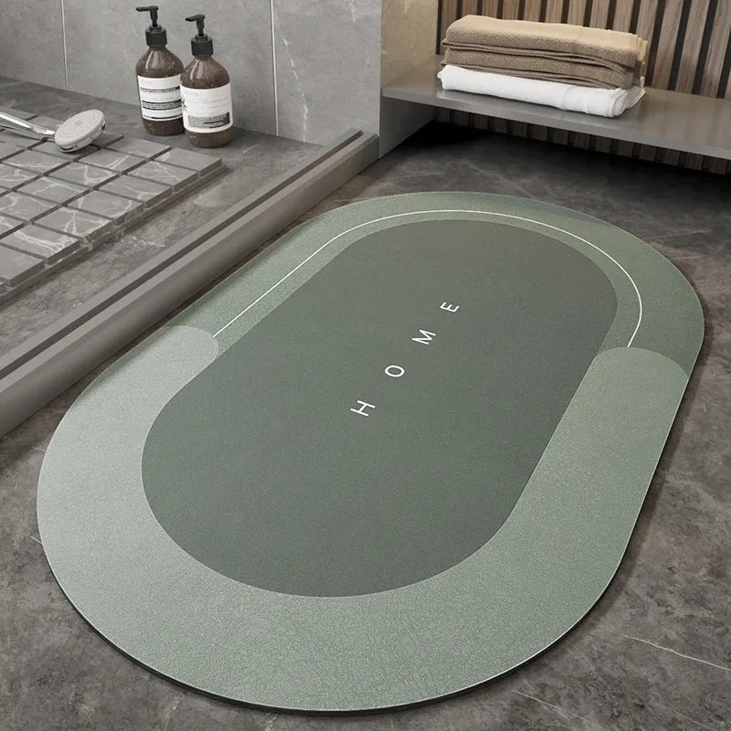 Soft blue oval bathroom floor mat placed on tiles beside a bathtub.