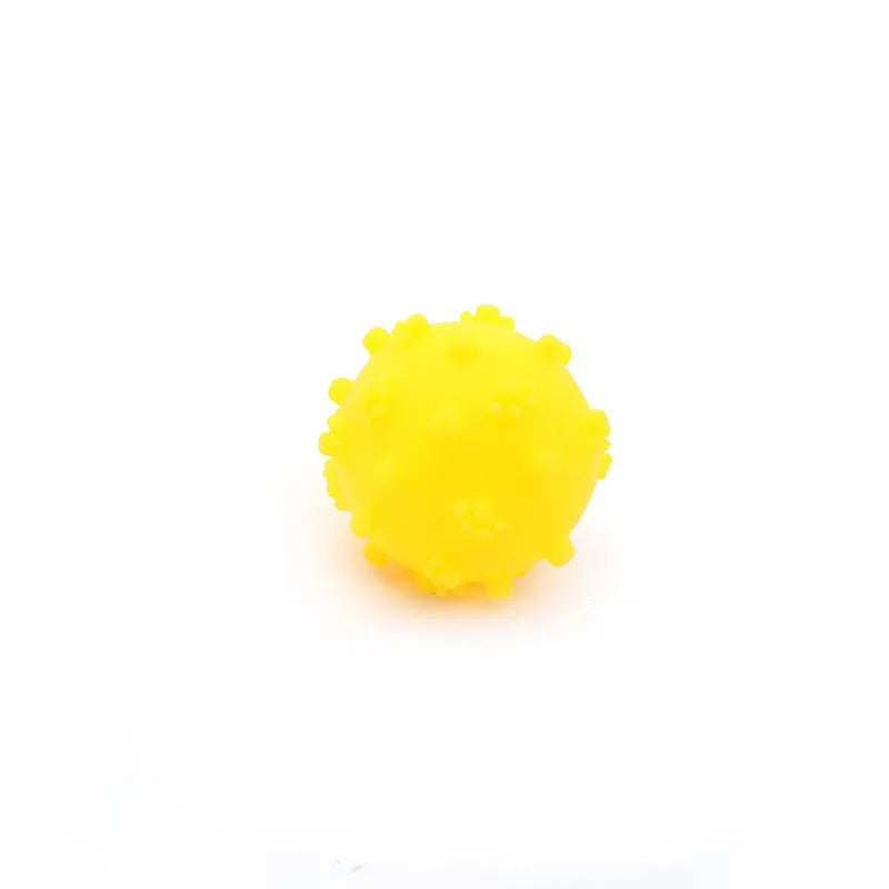 Bright blue, green, pink, and yellow spiky dog balls for small puppy teething and play.