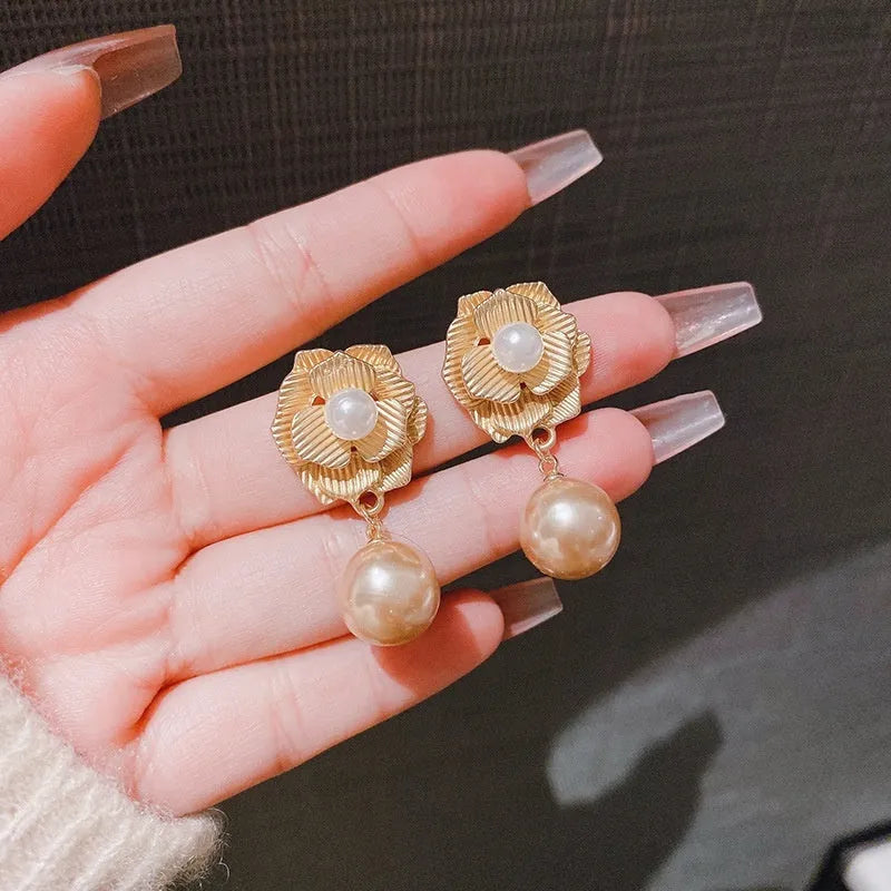 Gold electroplated alloy stud earrings with opal stone and Hong Kong style floral design featuring needle rose pearl and ice flower elements