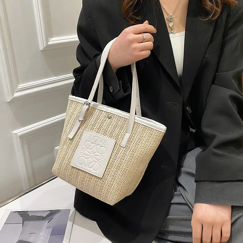 Straw woven women's shoulder bag with three-dimensional pockets in black colour option