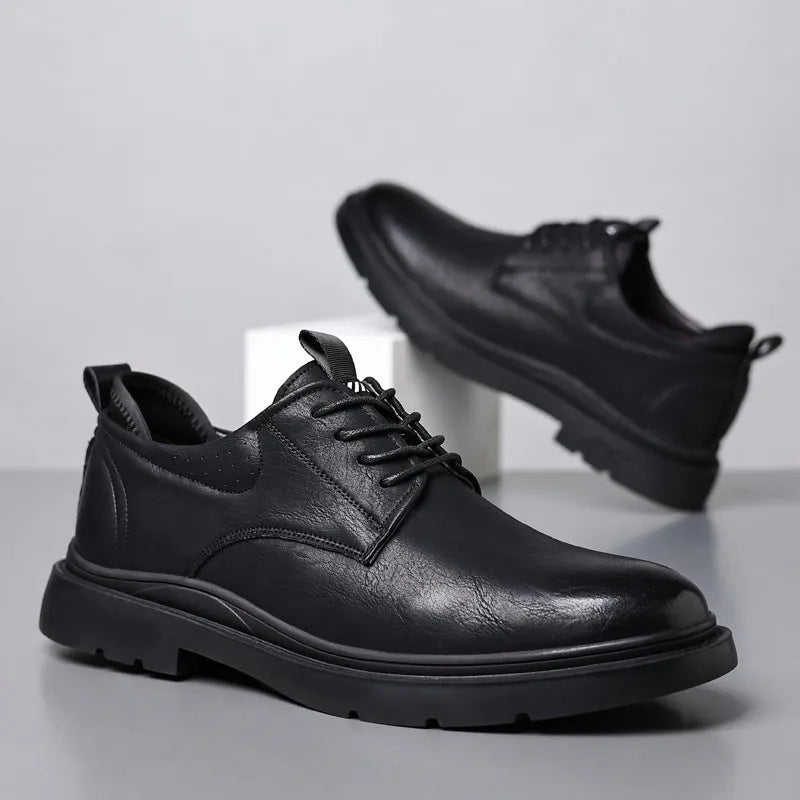 Men's black and brown cowhide leather sneaker shoes with rubber soles and decorative sewing lines.