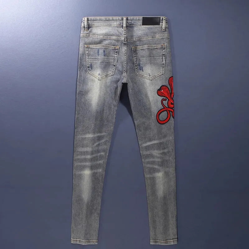 Men's slim fit jeans with distressed patches in washed-out old colour, showing front and back views