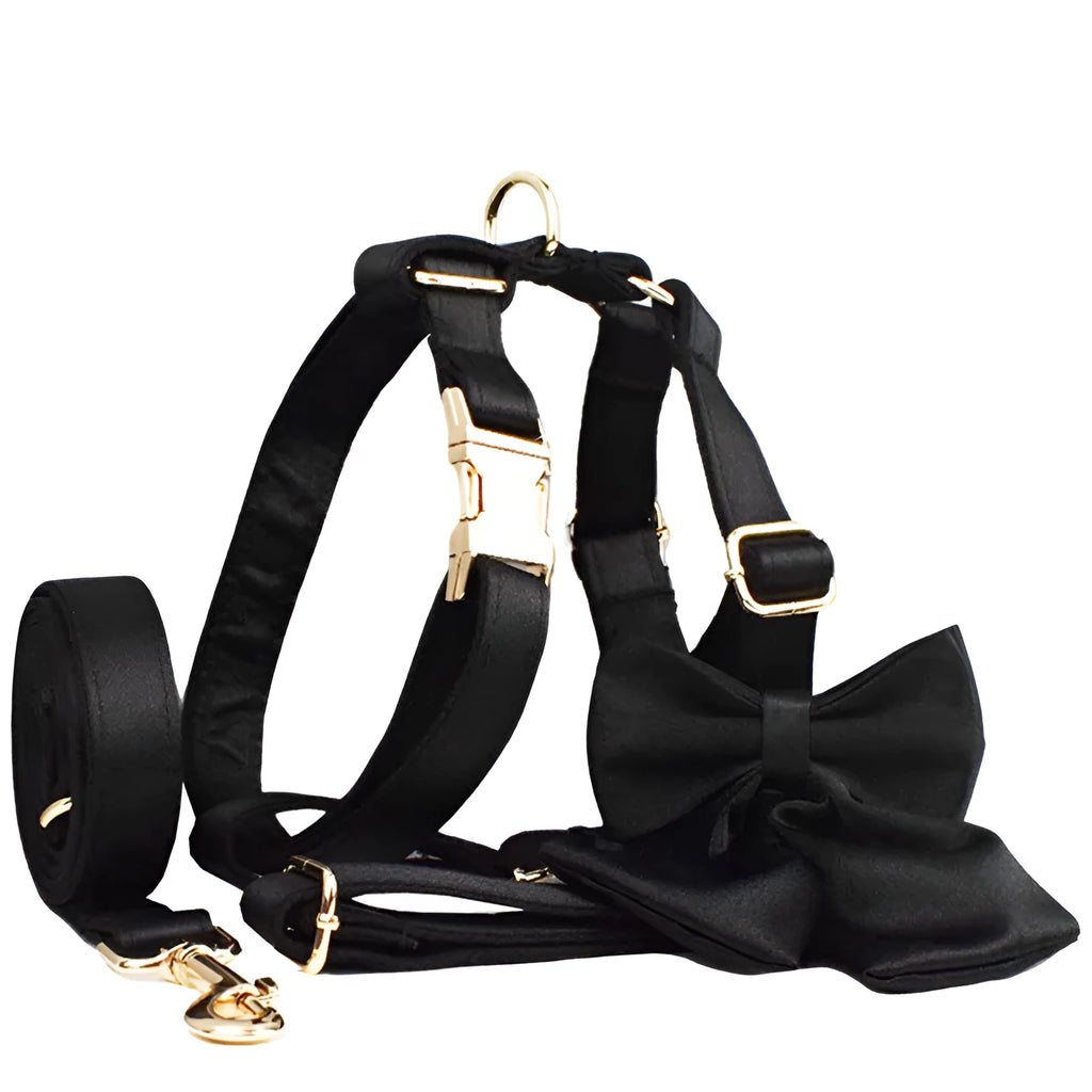 Fabric dog collar and lead set with matching chest strap vest and decorative bow tie.