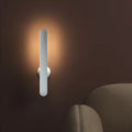 Geometric wireless table lamp with magnetic base in white colour showing touch controls