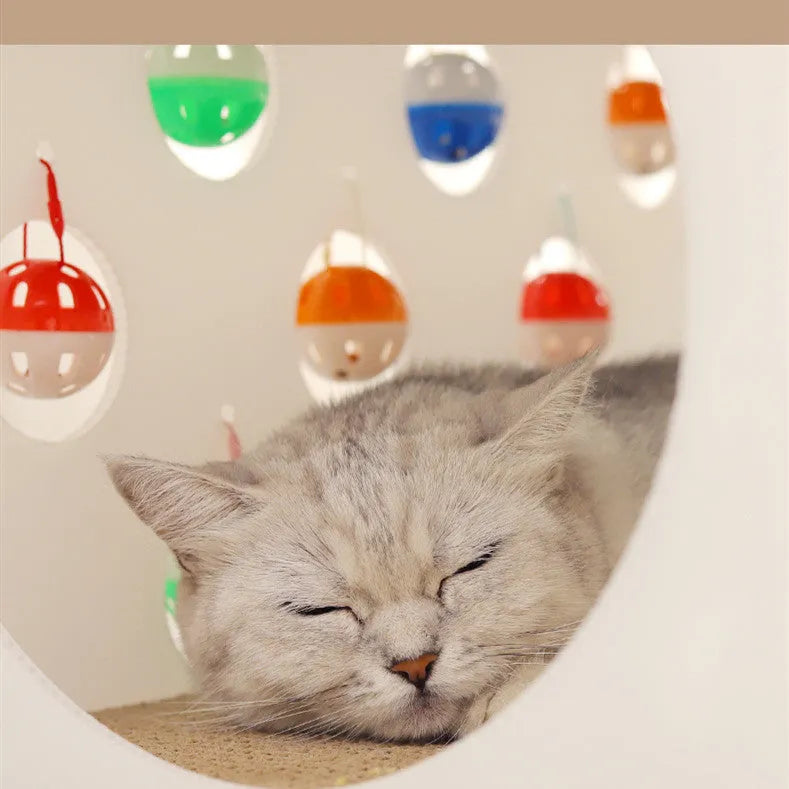 Plastic cat scratch board toy with integrated cat nest bed and tunnel, featuring a bell ball.