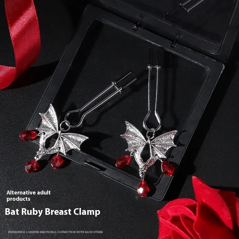 Silver alloy adjustable bat nipple clamp with ruby decorative clip for adult use.
