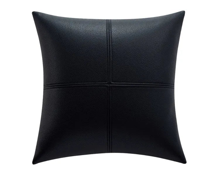 Soft cowhide leather pillow cover in a solid colour, shown in a Nordic-style room setting.
