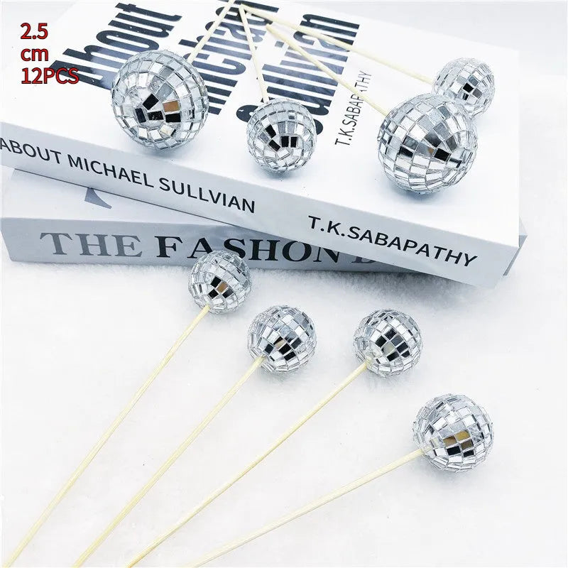 Glass disco ball cake decoration on a wooden stick, shown in different sizes for birthday cakes.