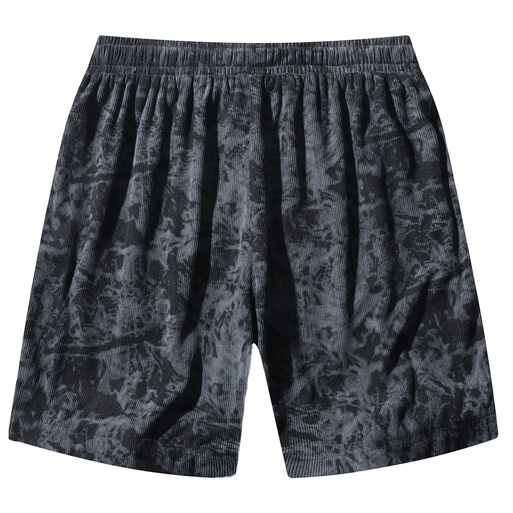 Men's straight-leg corduroy camouflage shorts in black, shown on a model.