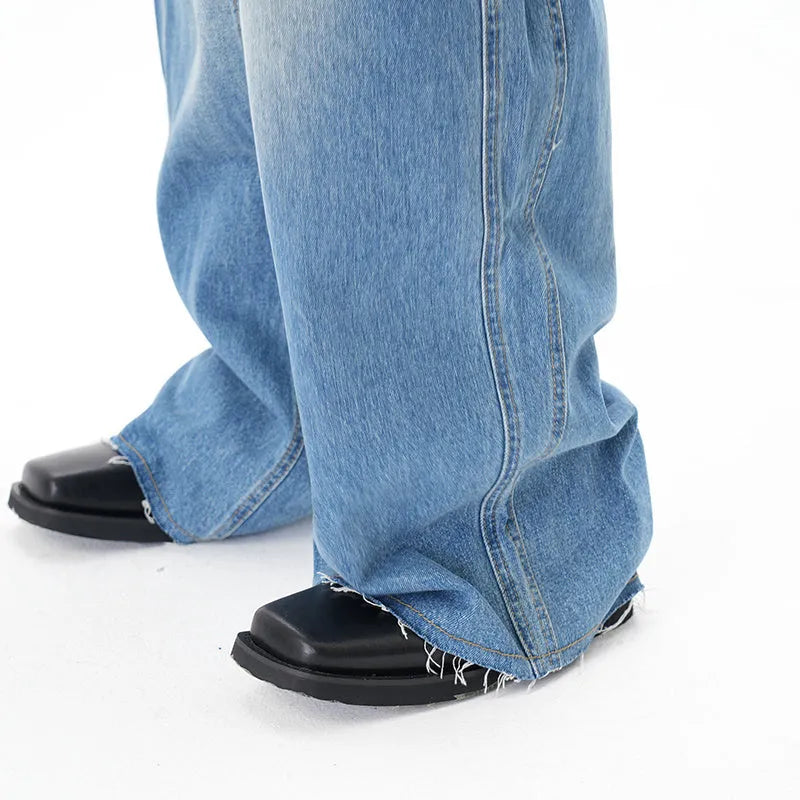 Light blue vintage washed wide leg jeans with zipper closure on mannequin