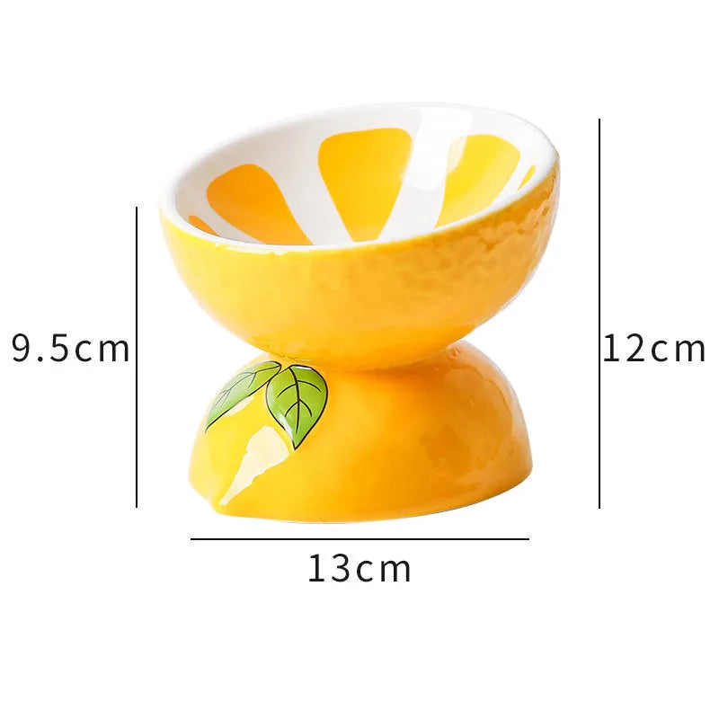 Ceramic raised cat bowl with tilted angle and fruit pattern