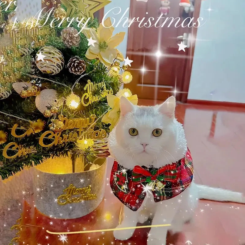 Red pet Christmas scarf with a jingle bell on a dog, showing the polyester fabric and festive design.