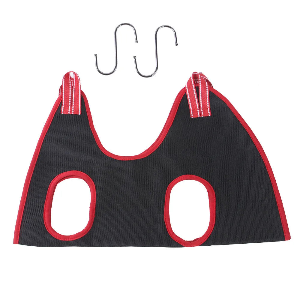Blue pet grooming hammock restraint bag with mesh panels and elastic straps hanging from a door.