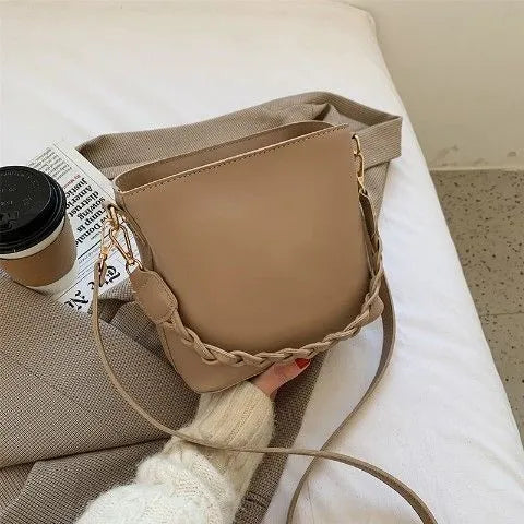 Retro woven PU leather unisex crossbody bucket bag in khaki colour.