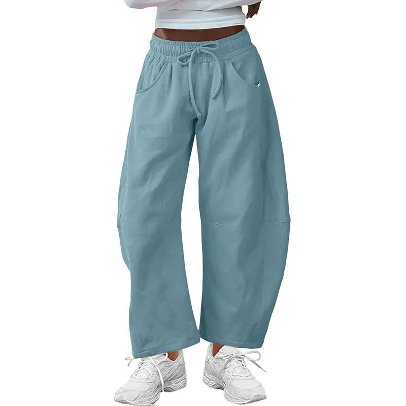 Loose cropped cotton sweatpants with elastic drawstring waist and side pockets in multiple colour options