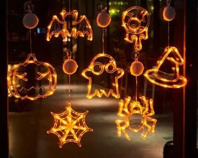 Set of seven Halloween-themed LED hanging lights with suction cups for window display