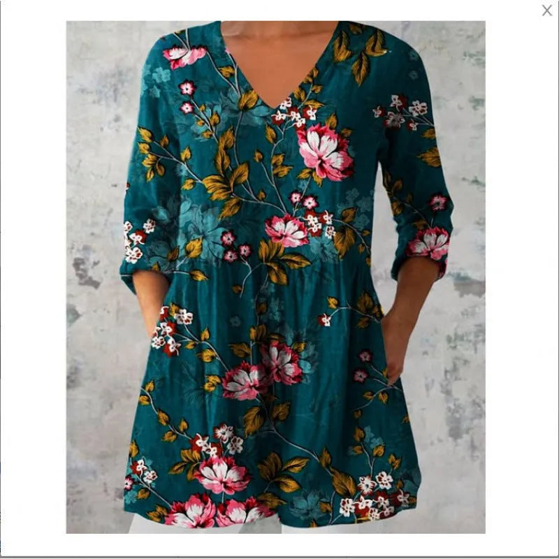 Women's printed wave pattern loose dress with wide waist and three-quarter length sleeves on a hanger.
