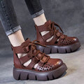 Women's black plush leather platform sandals with fish mouth toe and hollow hole design on a PU sole.
