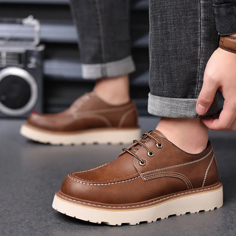 Men's black retro-style Martin boots with a round toe and mid-height rubber sole.