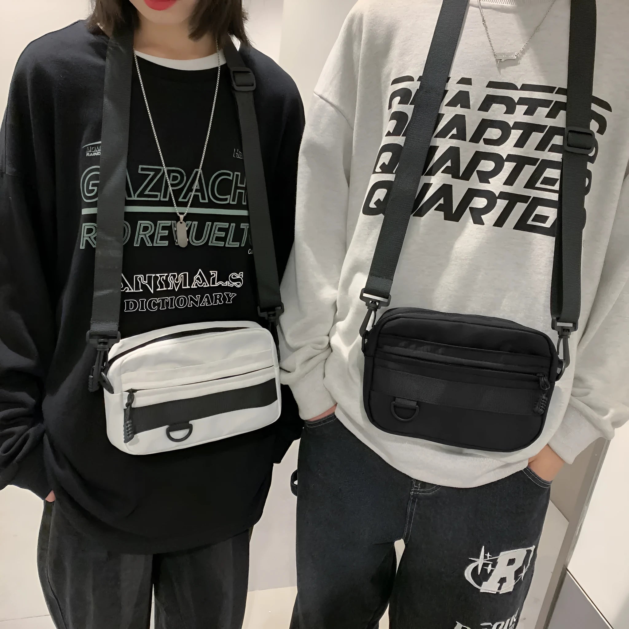 Men's solid colour nylon messenger bag with crossbody strap, shown in street style.
