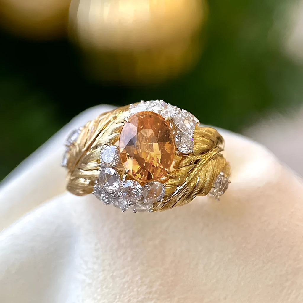 Women's gold geometric feather ring with yellow zircon stones on copper band