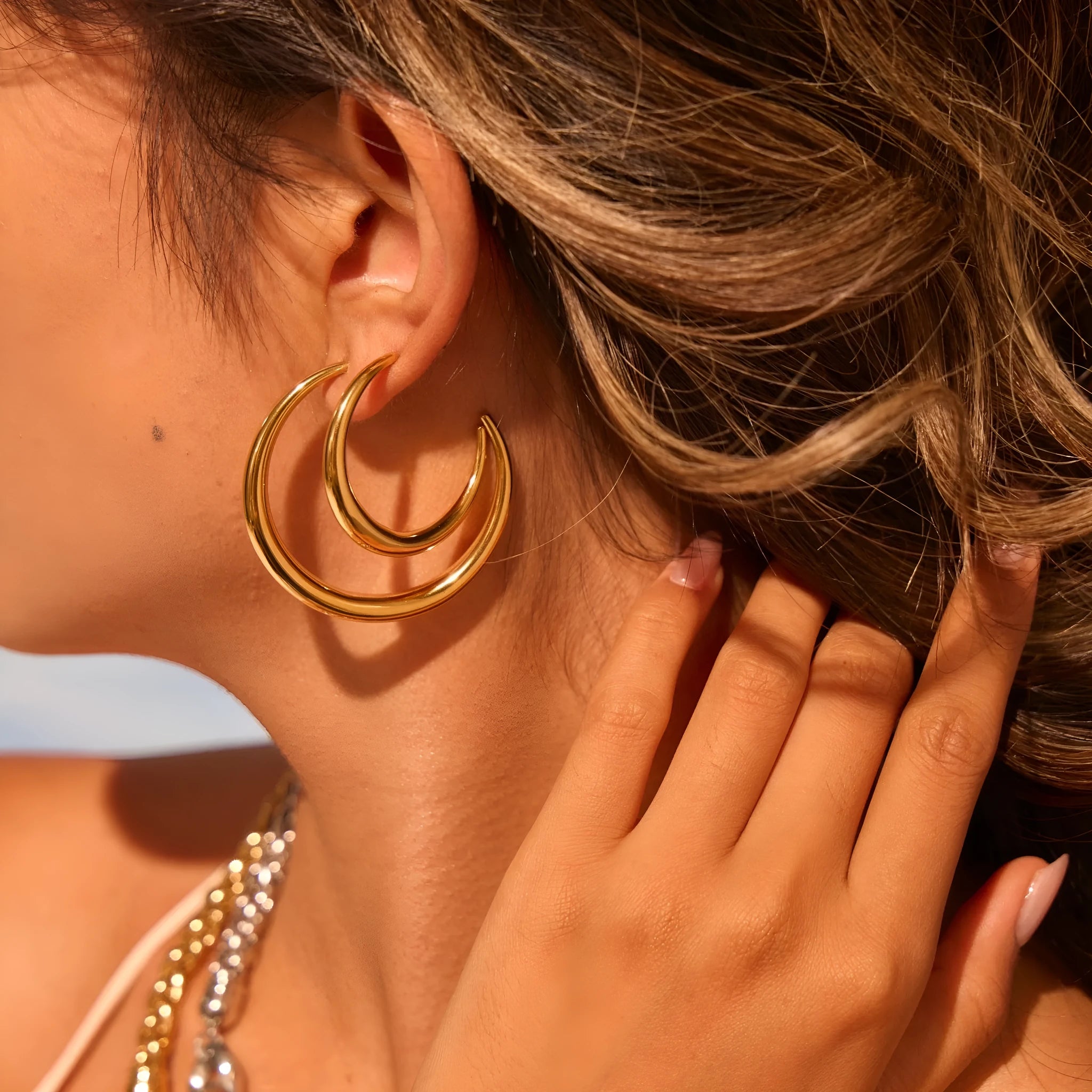 Titanium steel hoop earrings with 18K gold plating in small and large sizes