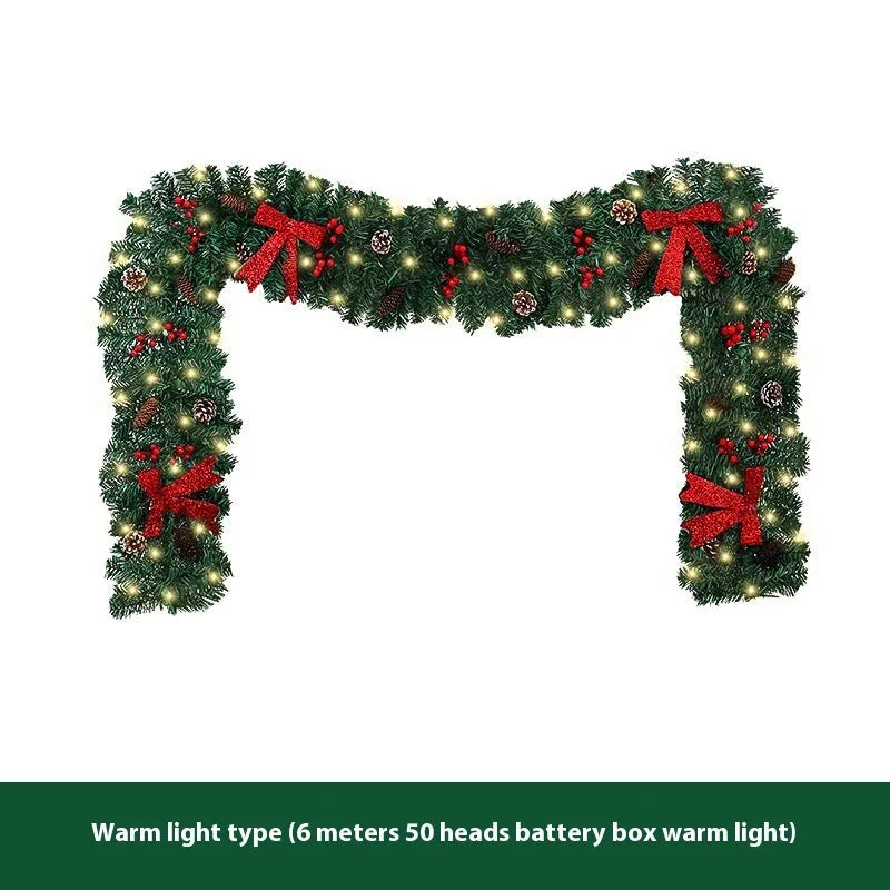 Christmas rattan pine cone bow decorative centrepiece with LED lighting on wooden table
