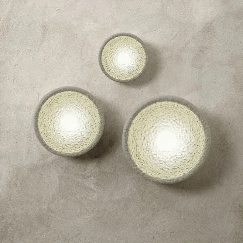 Japanese-style minimalist wall lamp with resin shade in three diameter options on modern interior wall