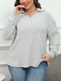 Women's plus size grey polo collar fleece shirt with lantern sleeves on a hanger