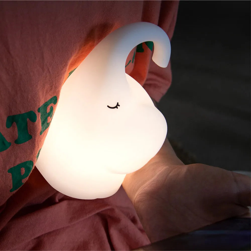 DOMI Elephant style LED night light with warm white glow on a bedside table.