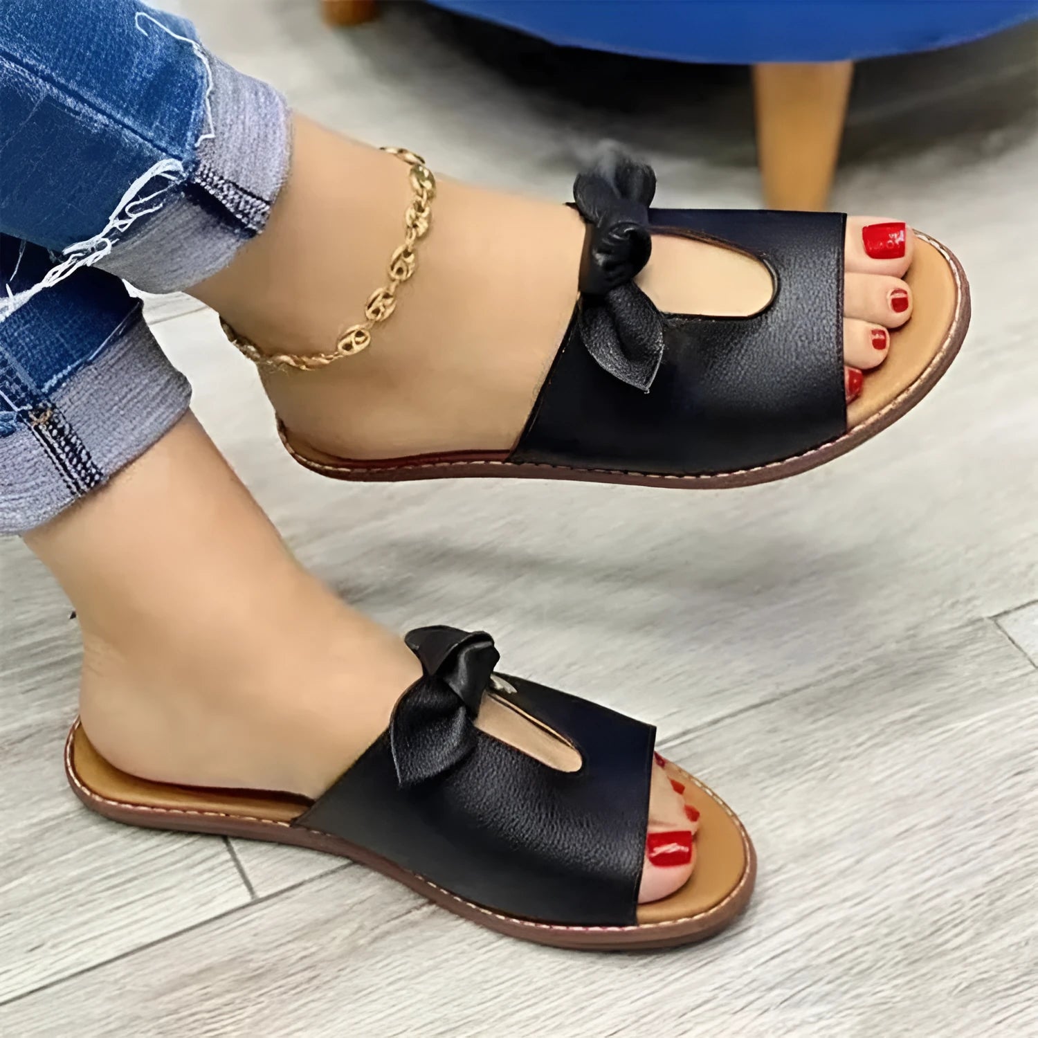 Ladies sandals with bow detail and fish mouth design in black, pink and gold colours