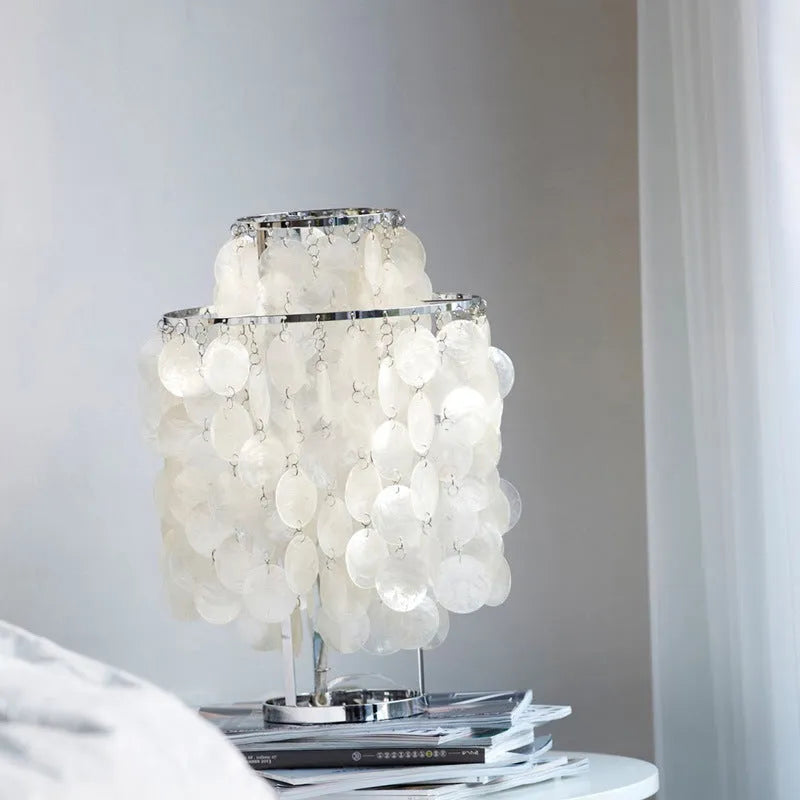 Modern shell bedside table lamp in chrome finish with 30cm diameter shade