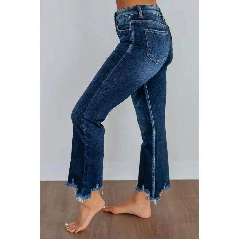 Women's solid colour denim jeans with hand-sanded distressing in dark blue and light blue colour options
