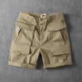 Men's stretch cotton cargo shorts in Army Green showing multiple pockets and straight-leg cut