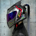 Dirty Braabs couples motorcycle helmets with mirrored visor designs in black clown and blue diamond patterns