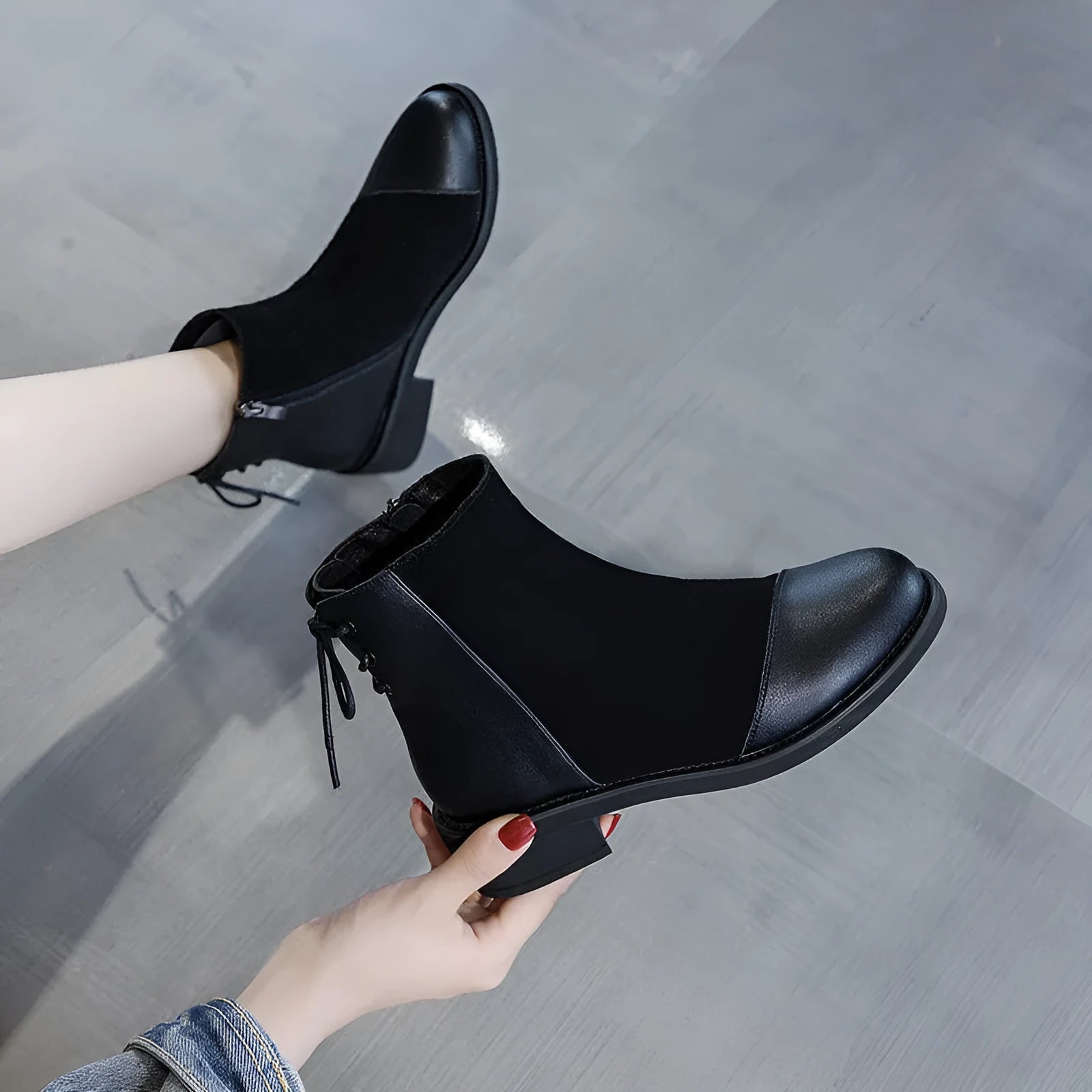 Black women's over-the-knee Martin boots with side zipper and decorative bow.