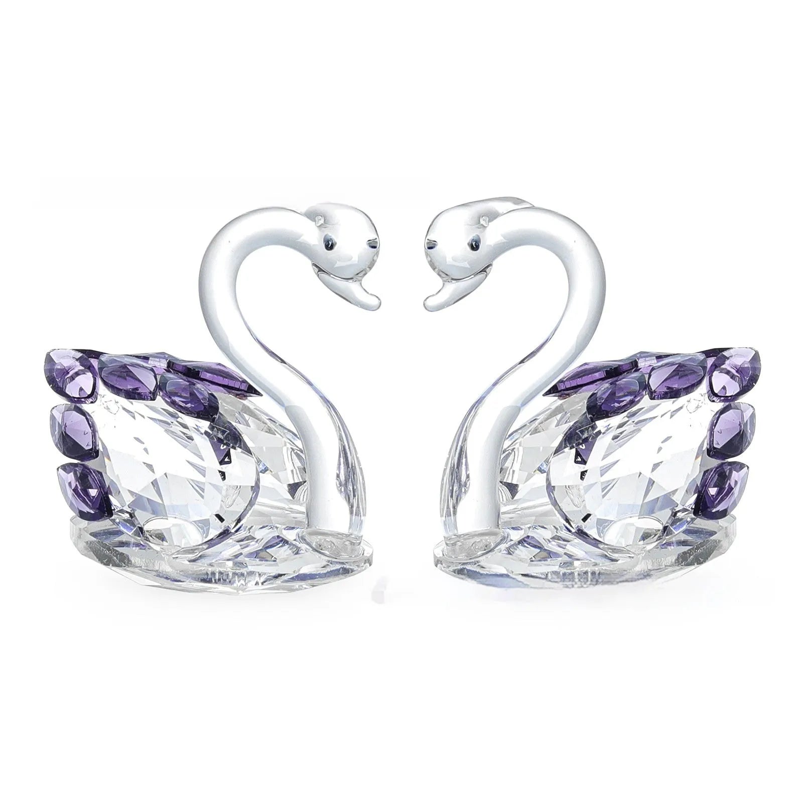 Crystal swan desktop ornament in red, blue, pink, or purple on a wooden surface.