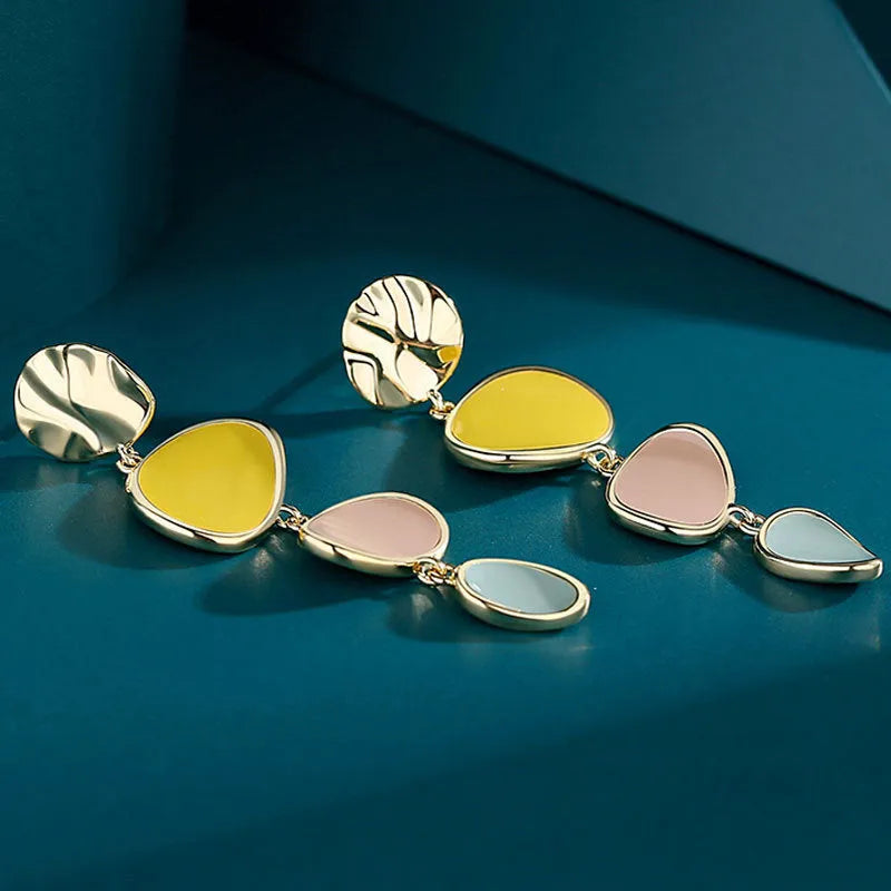 Pair of simple alloy disc earrings with a Morandi three-colour oil drip finish and sterling silver posts.