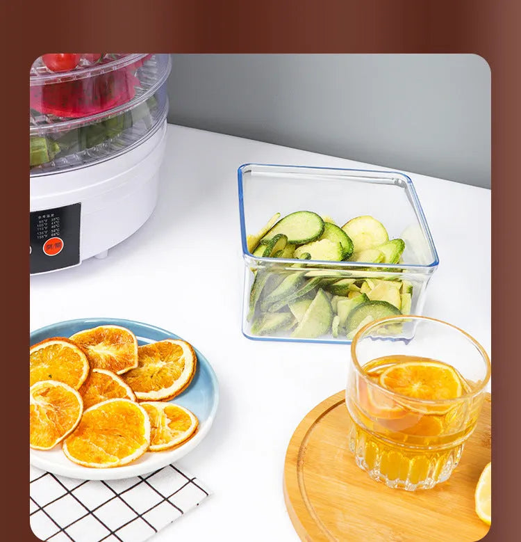 White five-tray food dehydrator with UK plug on kitchen countertop