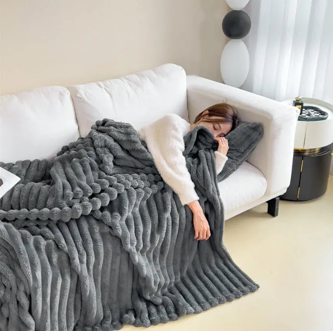 Soft Wind double-sided thickening bubble velvet blanket in a solid colour shown on a sofa.