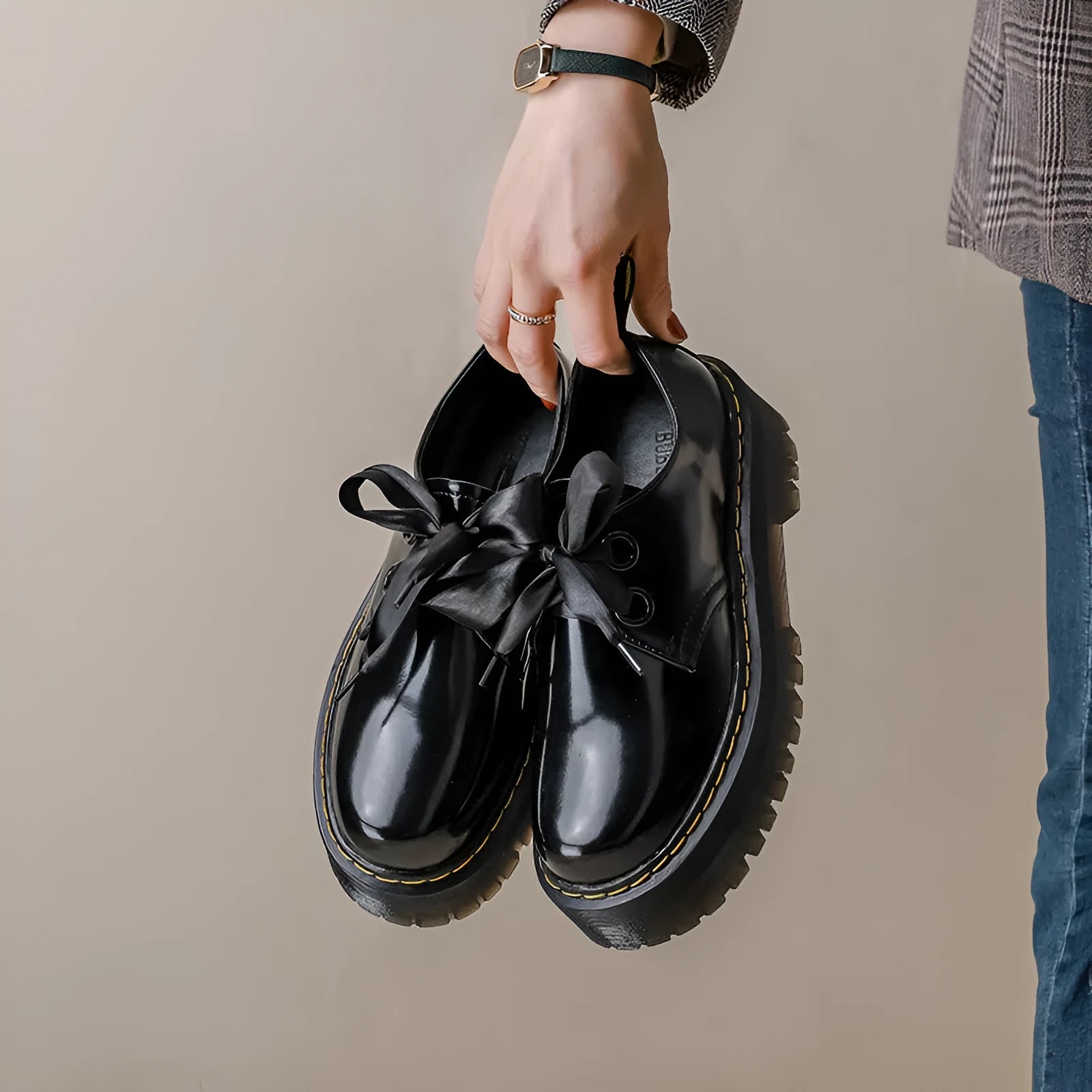 Women's thick soled leather shoes with ribbon cross straps and lace closure in black or white