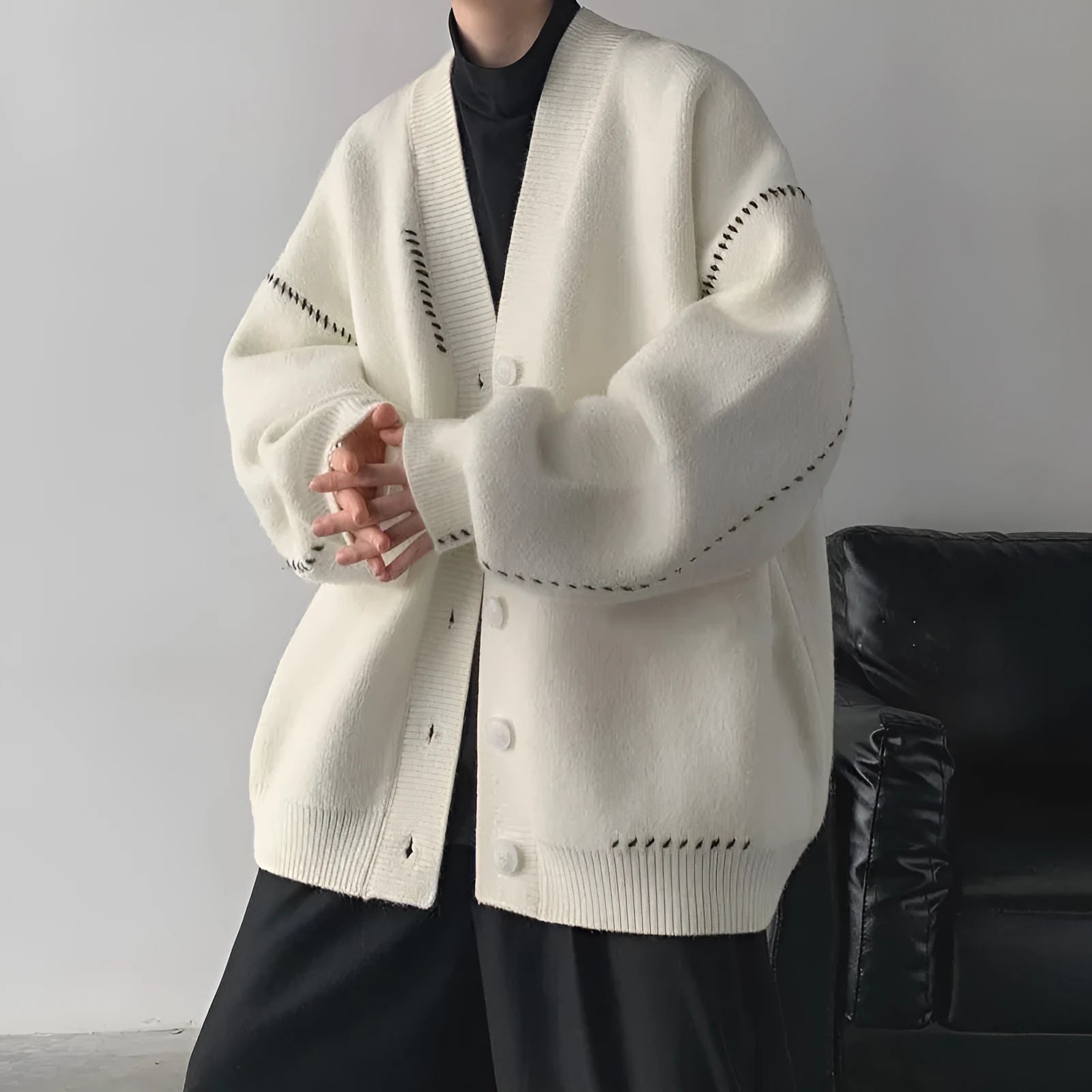 Women's loose fit knitted cardigan coat in black or white with long sleeves