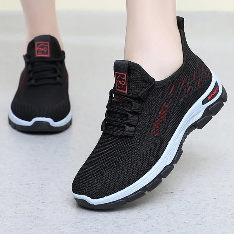Men's and women's low-top casual sneakers with a round toe and soft PVC sole.