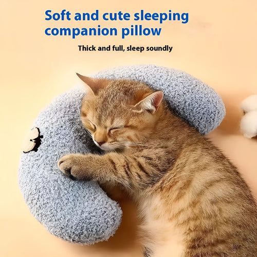 Blue moon-shaped and yellow question mark-shaped cloth pillows for cats, showing U-shaped neck support design.